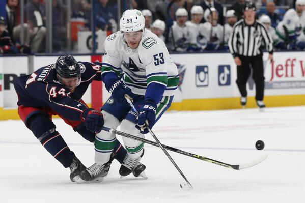Merzlikins stops 39 shots Blue Jackets beat Canucks 4 2 AP News
